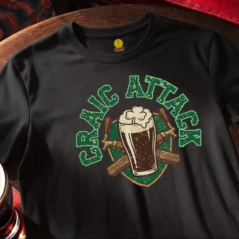 Black St Patrick's Day T Shirt with text saying Craic Attack on a wooden bar table