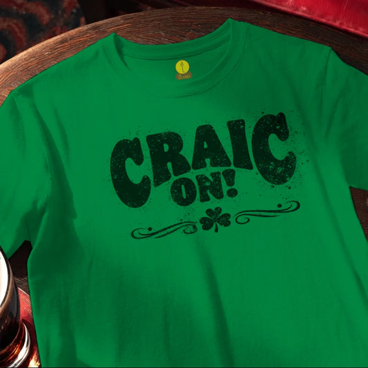 Green t-shirt with 'CRAIC ON!' text on a wooden bar table