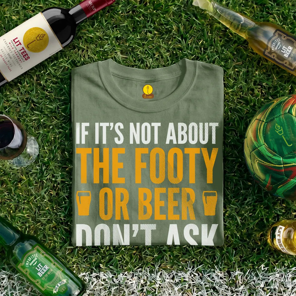 Green t-shirt with humorous text design saying 'If it's not about the footy or beer don't ask' on grass with beer bottles and a football