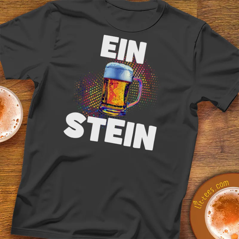 Black t-shirt with 'EIN STEIN' design on a wooden bar table