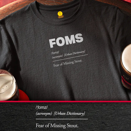 Black t-shirt with 'FOMS - fear of missinfg stout' definition text on a wooden surface with pints.