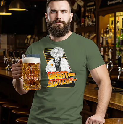 Man in a bar wearing a t-shirt with a graphic design and holding a beer mug.