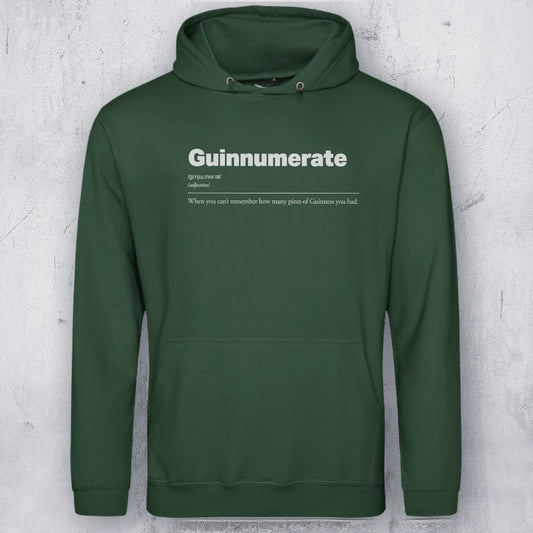 A dark green pullover hoodie with a white printed graphic on the chest reading 'Guinnumerate' and a dictionary-style definition underneath, displayed against a textured light gray background.