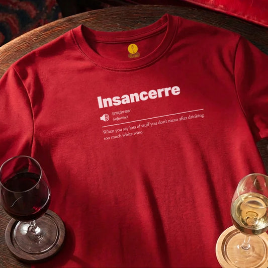 Red t-shirt with 'Insancerre' text on a wooden bar surface with wine glasses.