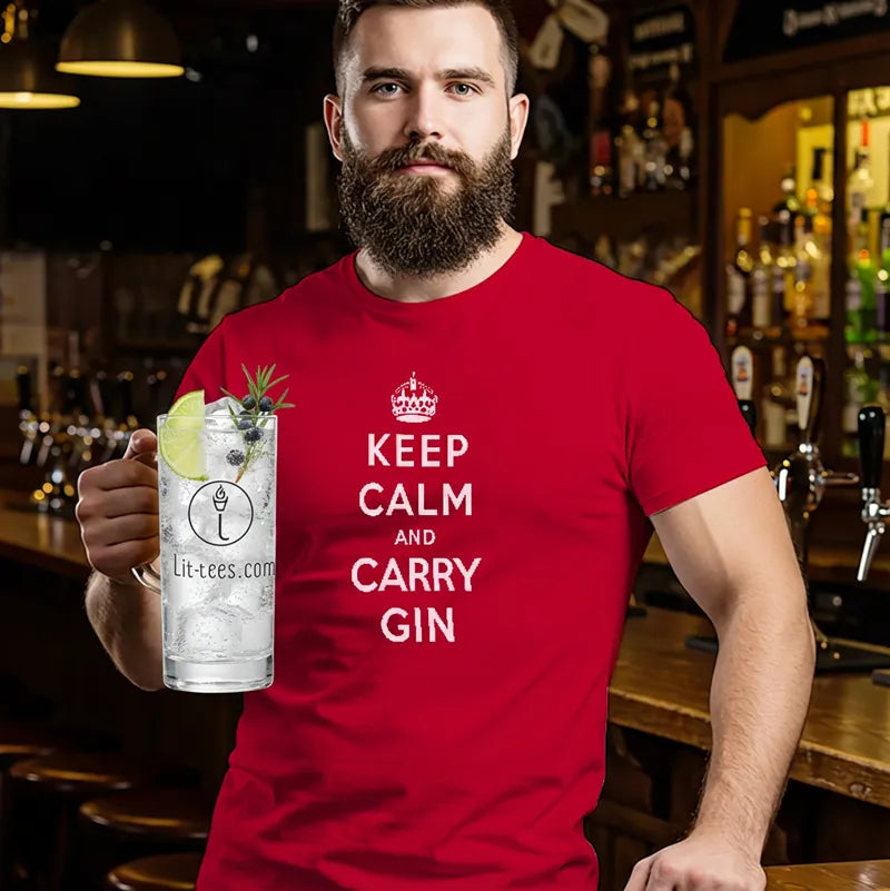 Man wearing a red t-shirt with 'Keep Calm and Carry Gin' text, holding a large gin cocktail in a bar setting.