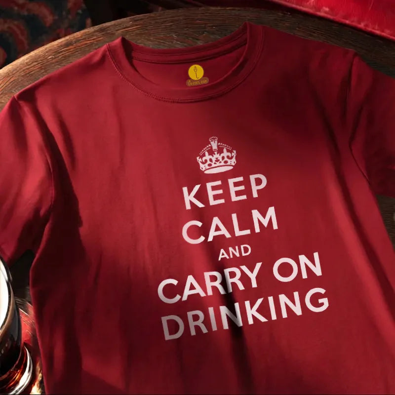 Red t-shirt with 'Keep Calm and Carry On Drinking' text on a round wooden bar table