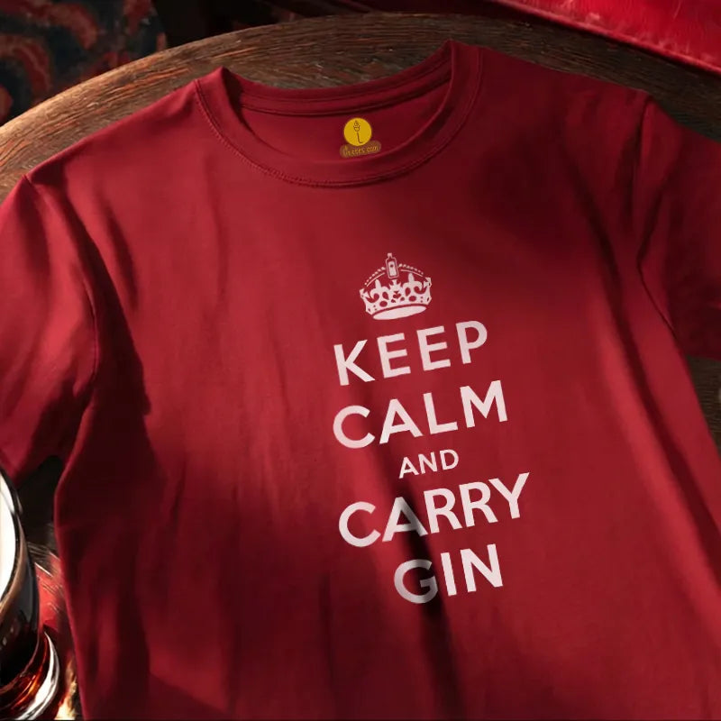 Red T Shirt on round bar table with humourous text saying Keep Calm and Carry Gin