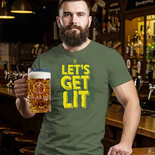 Man in a bar wearing a green t-shirt with 'Let's Get Lit' text, holding a beer mug.