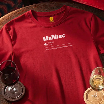 Red t-shirt with 'Mallbec' text and wine glasses on a wooden bar surface