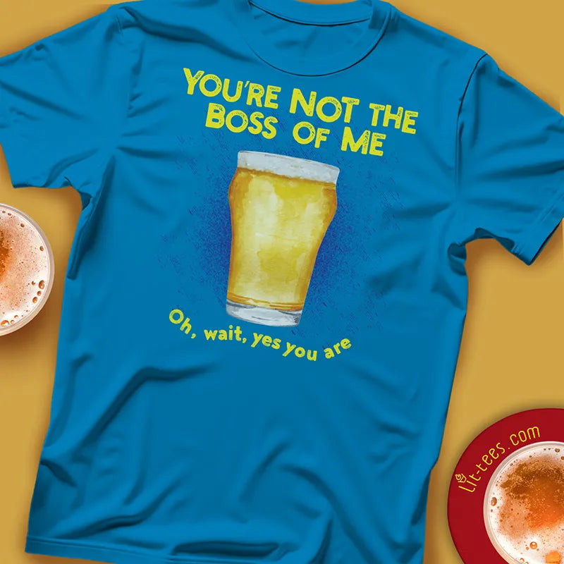 Blue t-shirt with a beer graphic and text saying 'You're not the boss of me. Oh wait, yes you are' on a yellow background