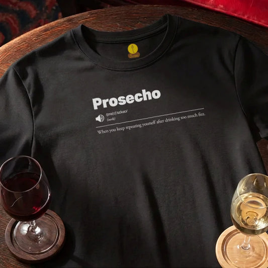 Black t-shirt with 'Prosecho' text on a wooden bar table with wine glasses.