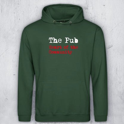 A dark green pullover hoodie with 'The Pub' and 'Heart of the Community' printed on the chest, displayed against a textured light gray background.