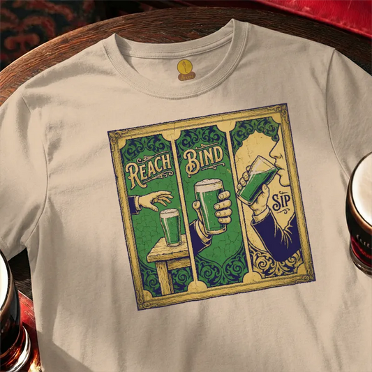 T-shirt with a graphic design of a person holding a beer mug and text 'Reach Bind' on a wooden bar table.