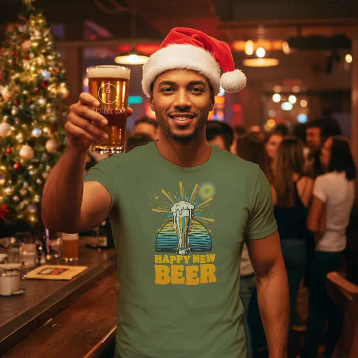 Man in a bar wearing a Santa hat and 'Happy New Beer' Christmas t-shirt, holding a beer.