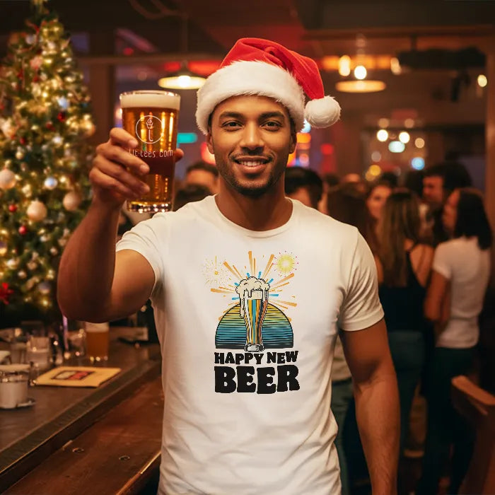 Man in a bar wearing a Santa hat and 'Happy New Beer' t-shirt, holding a beer.