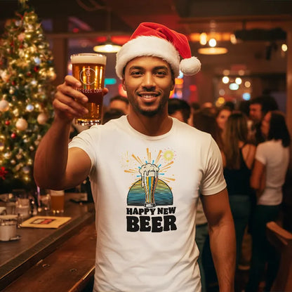Man in a bar wearing a Santa hat and 'Happy New Beer' t-shirt, holding a beer.