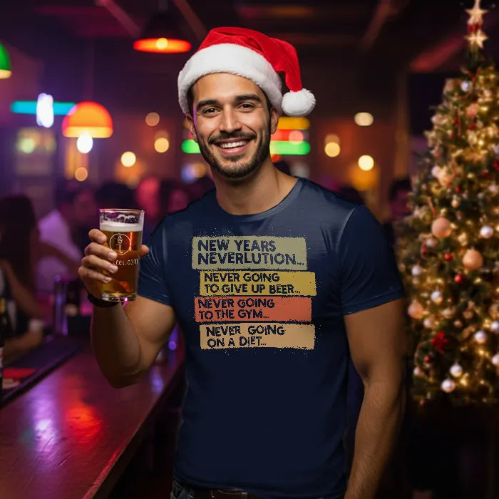 Man wearing a Christmas themed shirt with New Year's Neverlution text, holding a glass of beer in a festive setting. Glass has lit-tees.com printed on it.