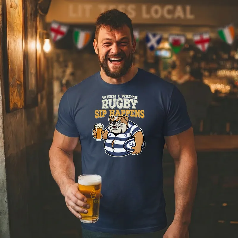 Man wearing a blue t-shirt with rugby-themed design and text saying 'When I watch Rugby sip happens' holding a beer in a bar.