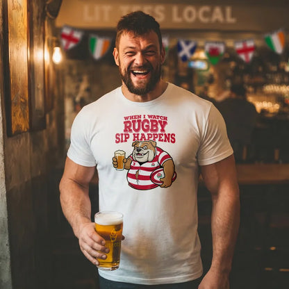 Man wearing a t-shirt with a rugby-themed design and text  saying 'When I watch Rugby, Sip happens' holding a beer in a bar.