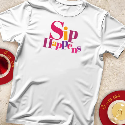 White t-shirt with 'Sip Happens' text, displayed with a cup of tea and saucer.