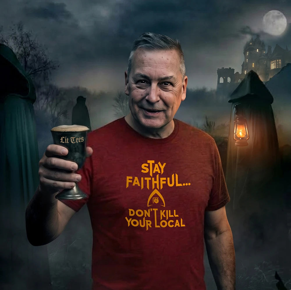 A man in a red graphic t-shirt holding a pint of beer, set against a dark, spooky Halloween background with cloaked figures and a haunted house under a full moon. The t-shirt features the text 'STAY FAITHFUL.