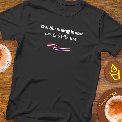 Black t-shirt with text and a Thai flag design saying 1 beer please in Thai on pub table with pints