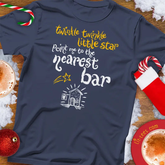 Navy Christmas t-shirt with humorous text reading 'Twinkle Twinkle little star -  point me the nearest bar' and graphics on a festive background